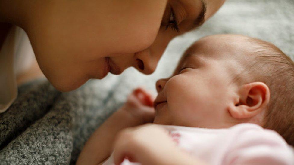 Mother looking at her baby