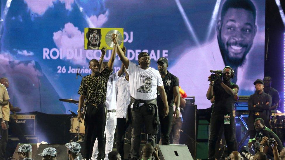 Malian singer Sidiki Diabate and Ivory Coast Defence Minister Hamed Bakayoko on stage