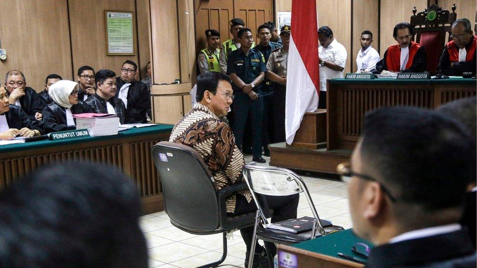 "Ahok" sits on the defendant's chair in the middle of the court, 13 December 2016, Jakarta, Indonesia.