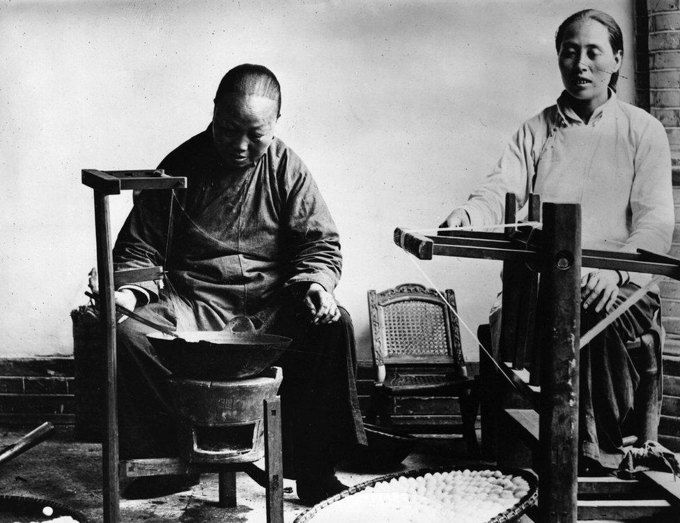 Chinese workers spinning silk, circa 1912