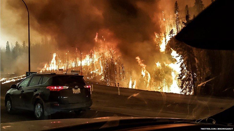 TWITTER.COM/JEROMEGAROT picture of fire raging in Alberta