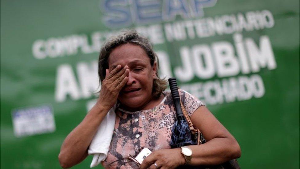 A relative of a prisoner reacts in front of the main entrance of Anisio Jobim prison in Manaus, Brazil, January 3, 2017