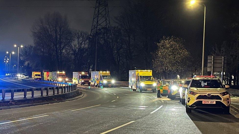 Ambulances lining up on road by the scene of fire