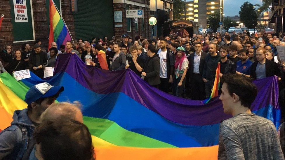 Crowds prepare for a vigil in Birmingham