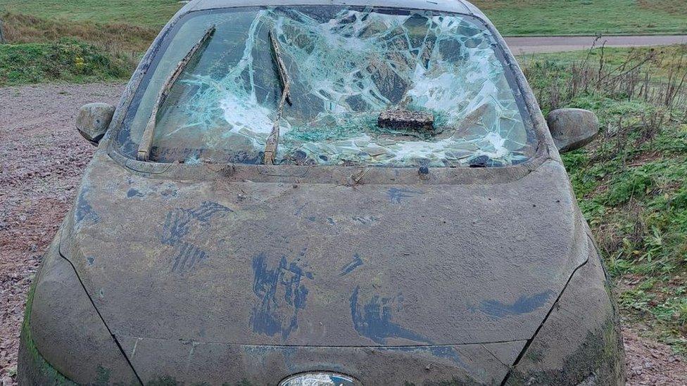 Ford KA with smashed windscreen and covered in mud has been pulled from the water at Alton Water Reservoir