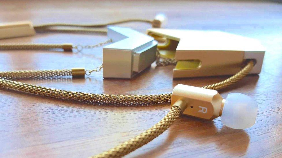 The headphones are stored in a necklace