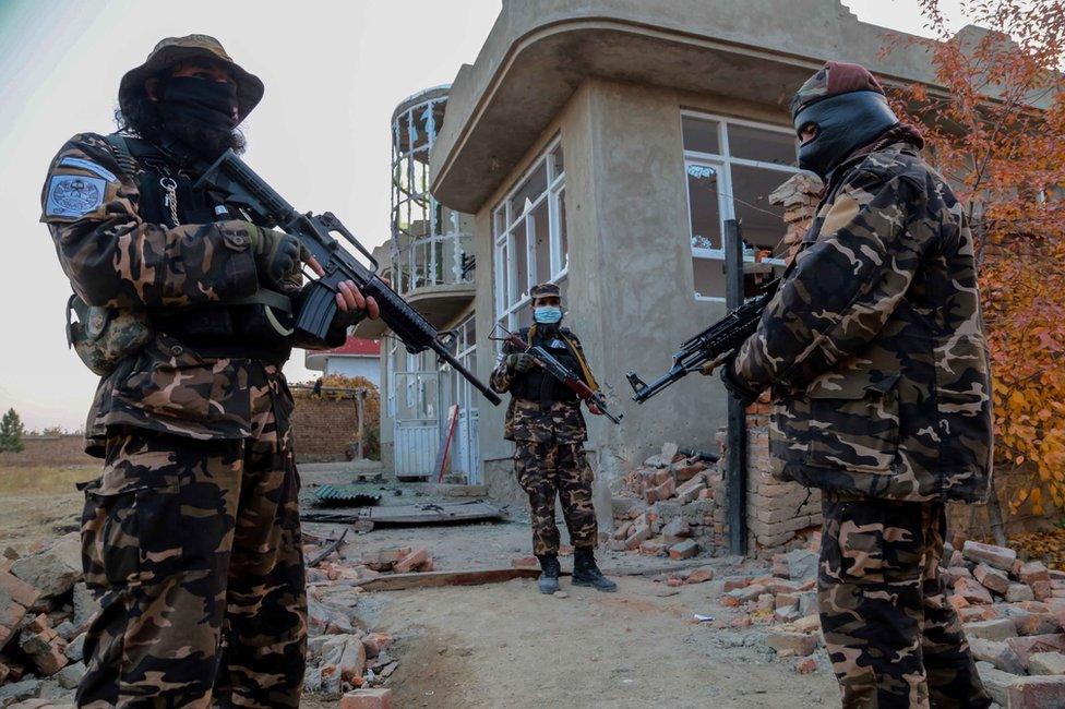 Taliban inspect the scene of an operation against the IS militants at an IS hideout in the outskirts of Kabul, Afghanistan, 18 November 2021.