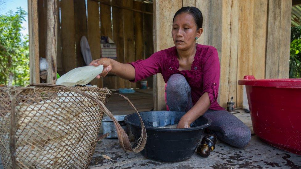 Liz Chicaje Churay prepares yuca