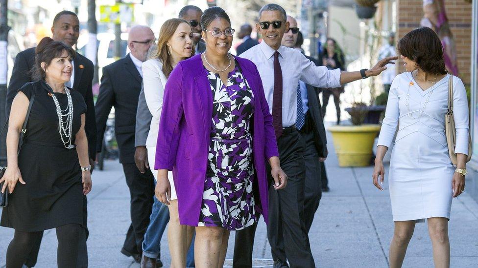 Obama, shown walking in Washington with former inmates