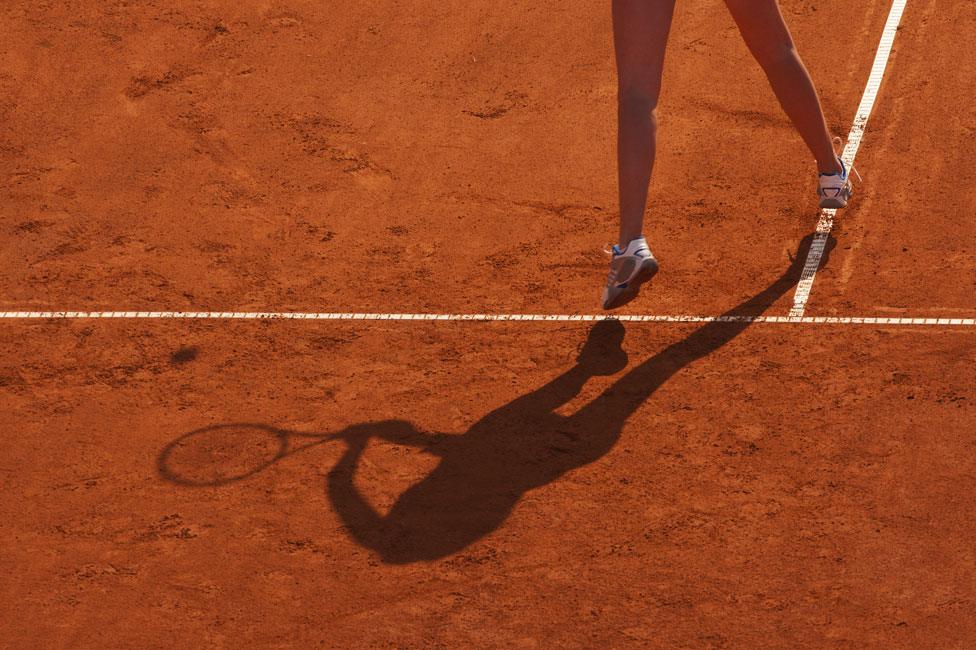 Tennis player on clay court