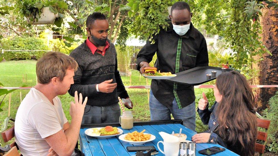 Waiters serving a table