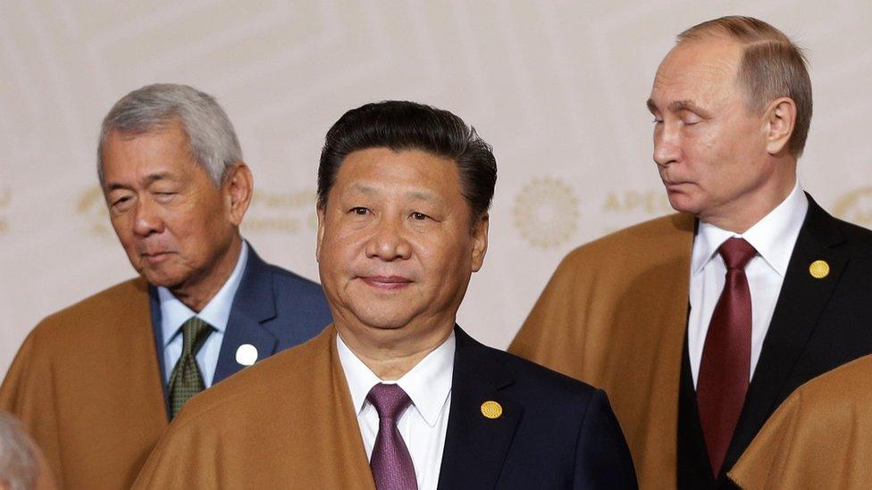 China's President Xi Jinping, centre, waiting for the group photo to be taken at the annual APEC summit in Lima, Peru, Sunday 20 November 2016.