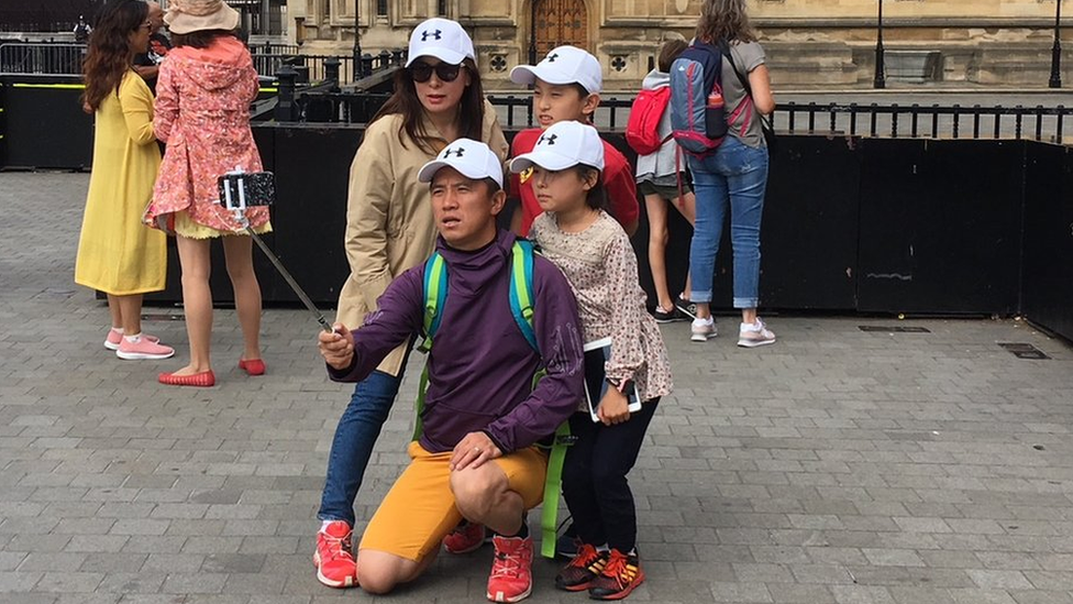 A family poses for a selfie just metres from Tuesday's suspected terror attack.