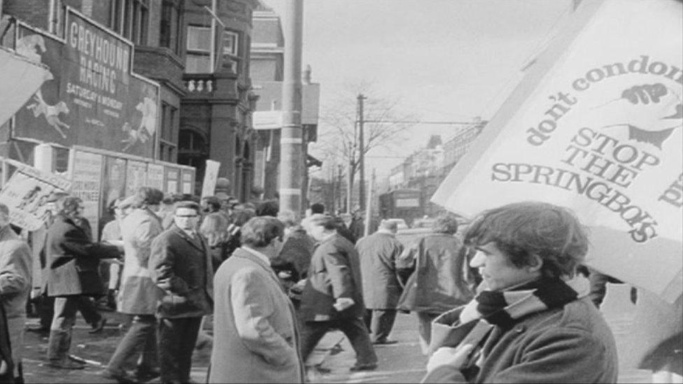 protestor holding placard