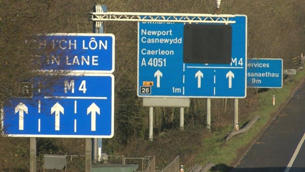 Signs alongside M4