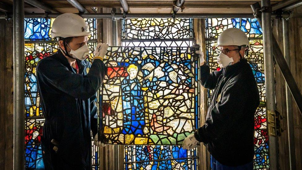 Workers with the window panels