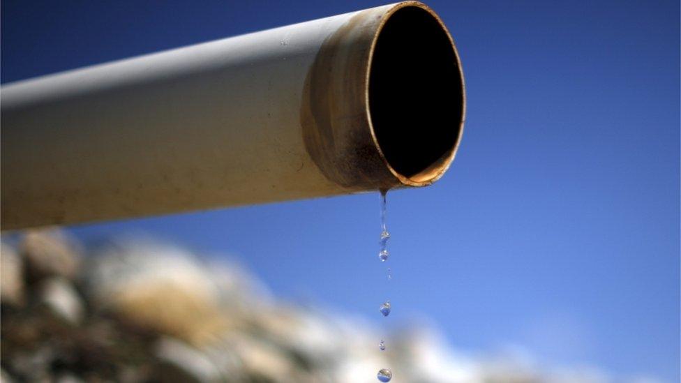 A dry pipe drips water on Gless Ranch in Kern County, California, in this file photo taken on 23 July 2015.