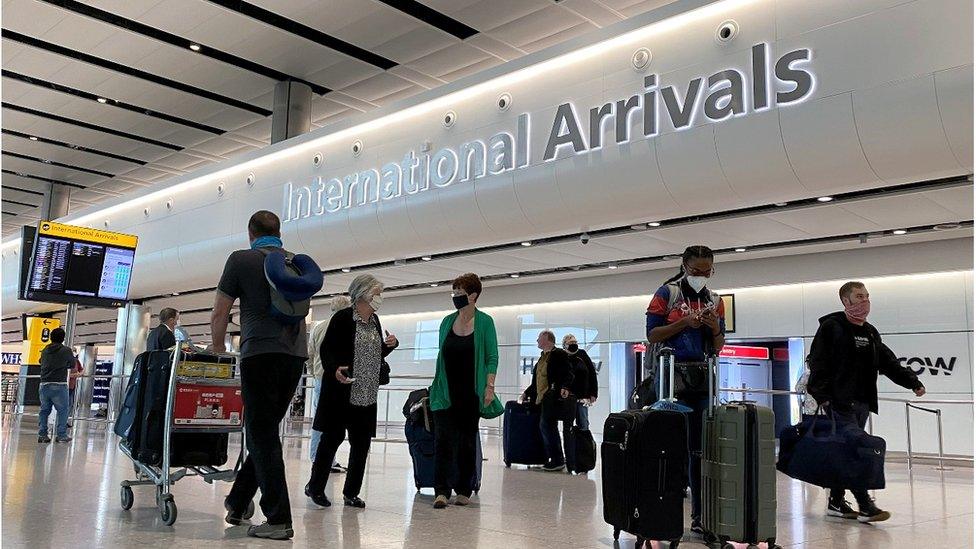 Travellers at Heathrow Airport