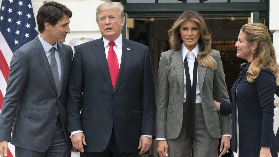 US President Donald Trump (2-L) and First Lady Melania Trump (2-R) welcome Prime Minister of Canada Justin Trudeau (L) and his wife Sophie Gregoire Trudeau (R) to the White House on 11 October 201