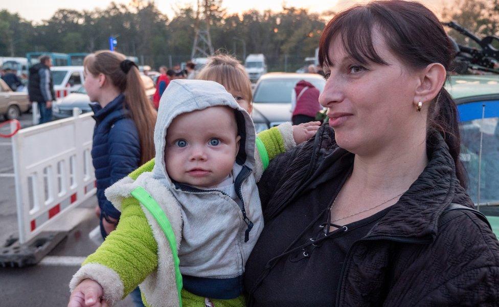 A Ukrainian mother holding her baby