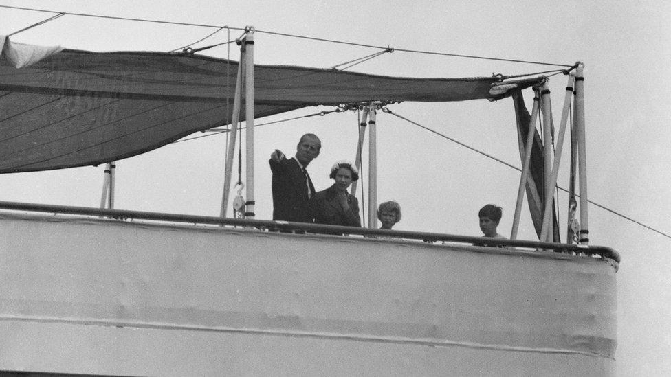 Queen Elizabeth II, Prince Philip, Duke of Edinburgh, Charles, Prince of Wales, and Anne, Princess Royal on Her Majesty's Yacht Britannia at the Port of Southampton, Hampshire, 1958