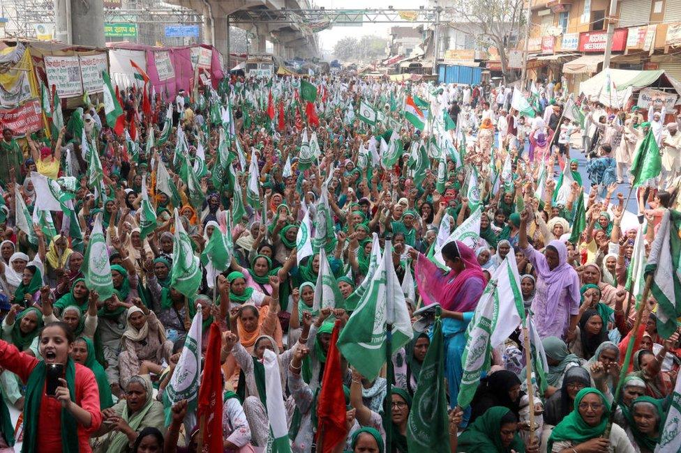 Indian women farmers from Haryana and Punjab seen seated on the road side while shouting anti-government slogans at the protest sites, Tikri border.