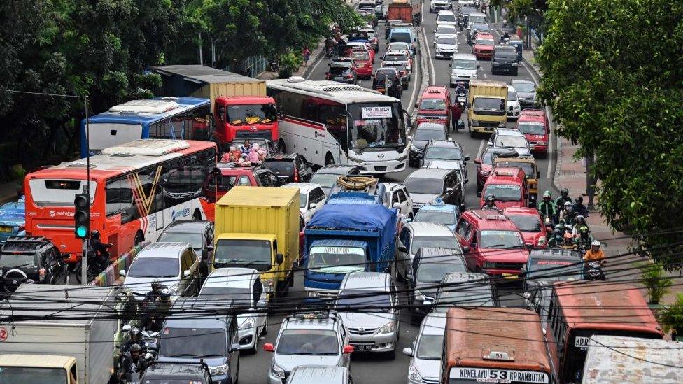 Motorists are seen during a traffic jam in Jakarta on March 6, 2019.