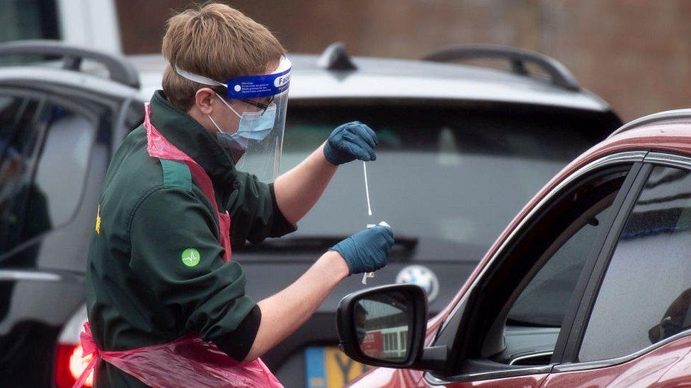 man take swab through car window