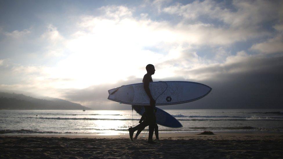 A surfer in California