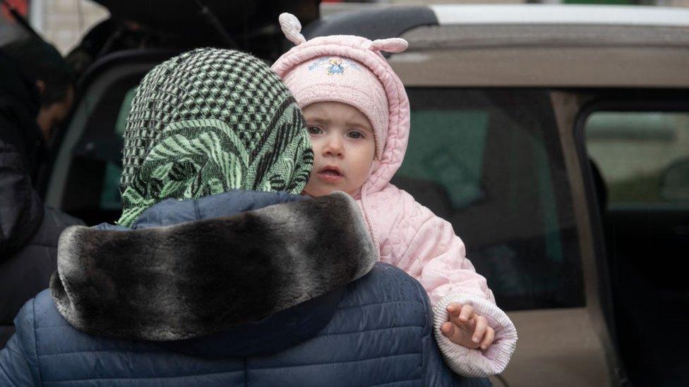 Refugees from Chernihiv and the towns nearby take shelter inside a school in the town of Kulykivka on 31 March