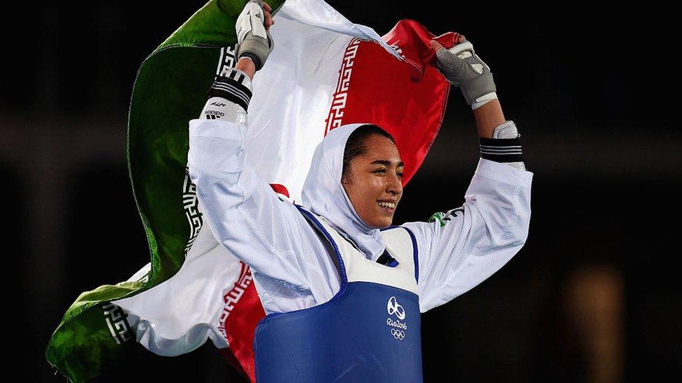 Iran's Kimia Alizadeh Zenoorim celebrates winning Taekwondo bronze at the Rio Olympics (18 August 2016)