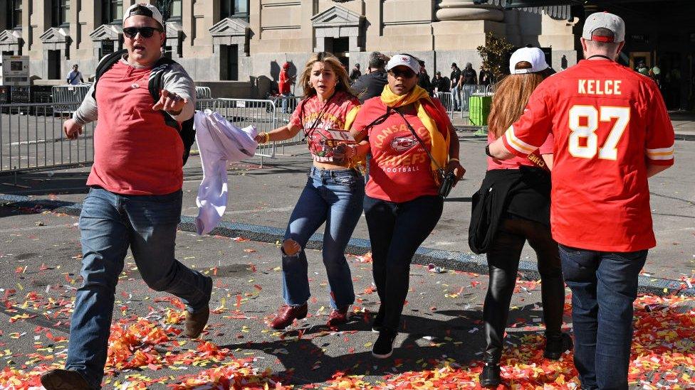 People flee after shooting near the Kansas City Chiefs Super Bowl victory parade in Kansas City, Missouri, on 14 February 2024