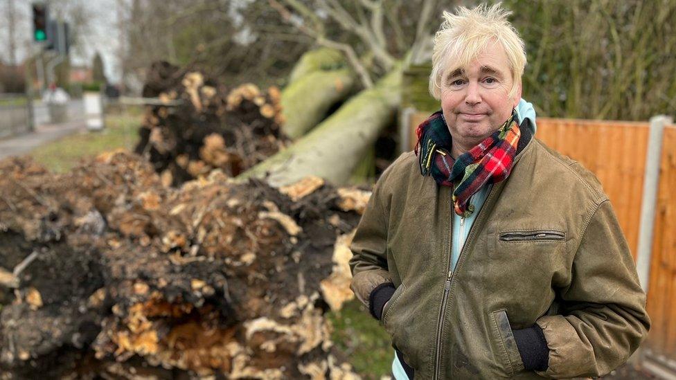 Iain Farquharson standing next to a felled tree