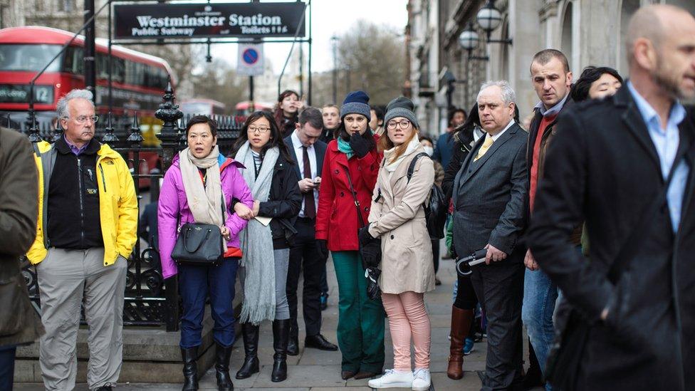 Crowd held back outside Westminster Tube Station.