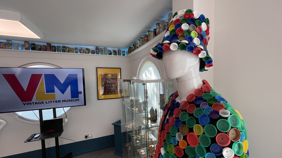 Litter in the museum including bottle caps