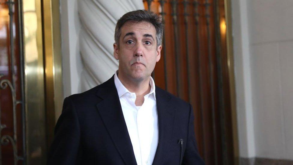 Michael Cohen, the former lawyer for US President Donald Trump, leaves his apartment to begin serving a three-year sentence