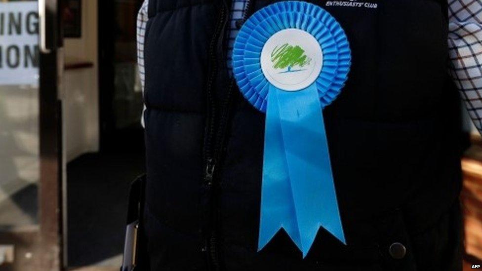 Man wearing Conservative rosette