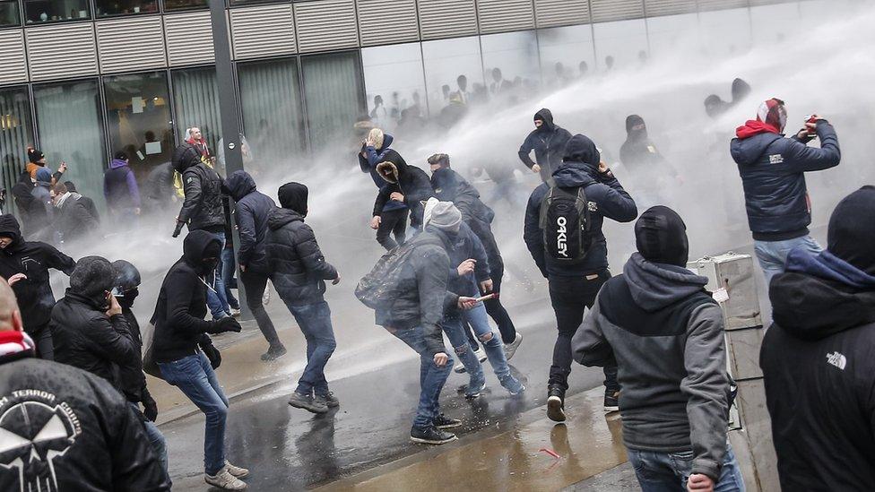 Protesters in Brussels march against the UN migration pact