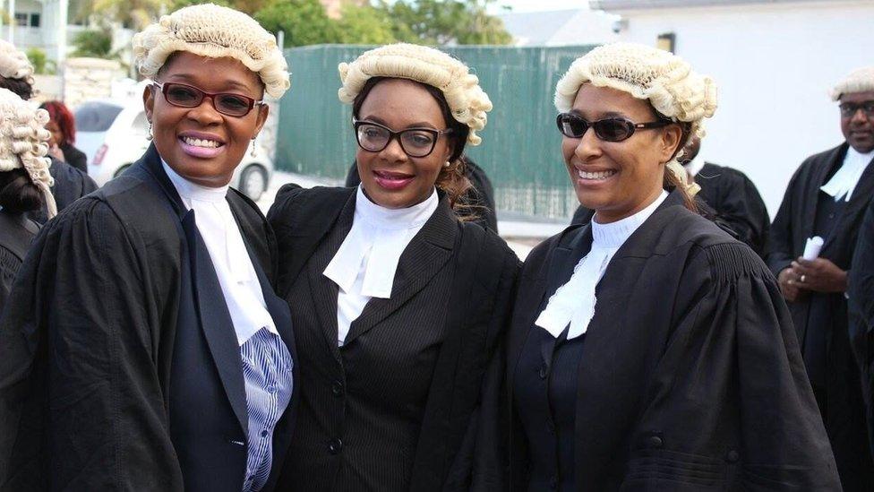 Three female lawyers in their robes