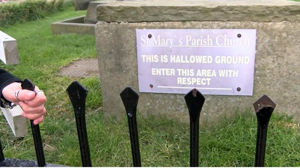 Sign in churchyard