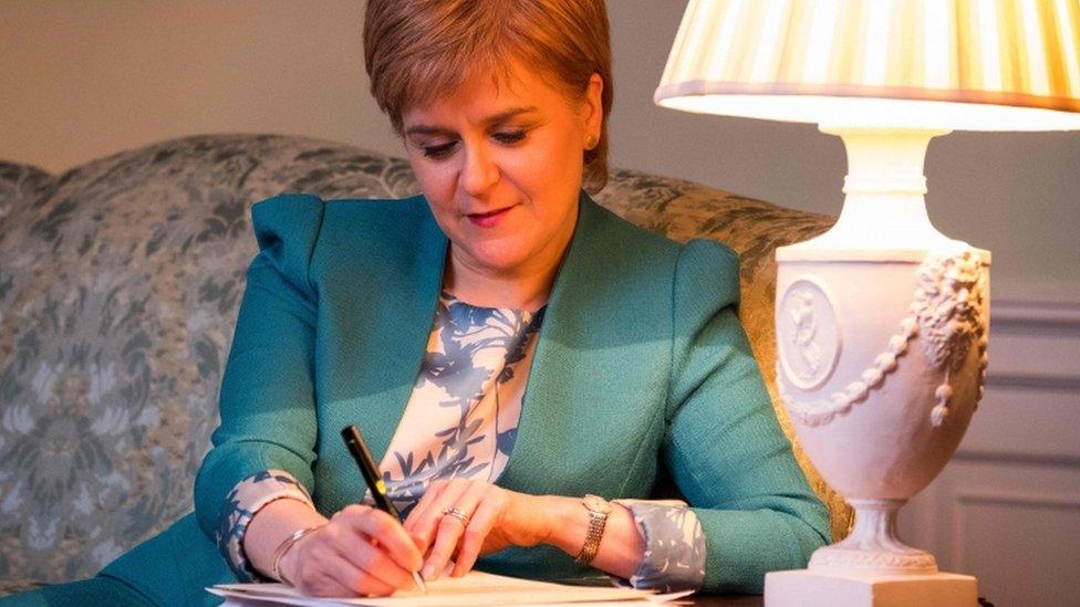 A handout picture released by The Scottish Government on March 30, 2017 shows Scotland"s First Minister Nicola Sturgeon working on her Section 30 letter to the British Prime Minister Theresa May