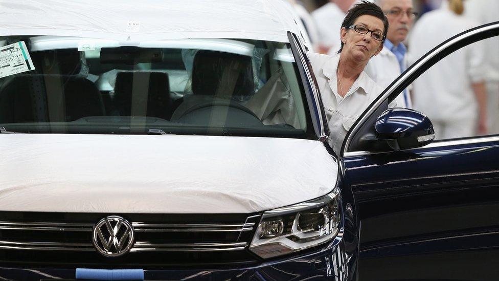 workers on a VW production line