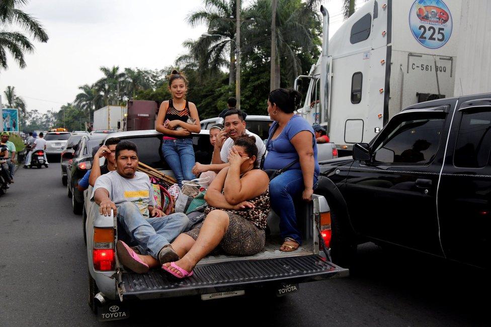 Displaced people leave an area affected by the eruption of Fuego volcano in Escuintla, Guatemala