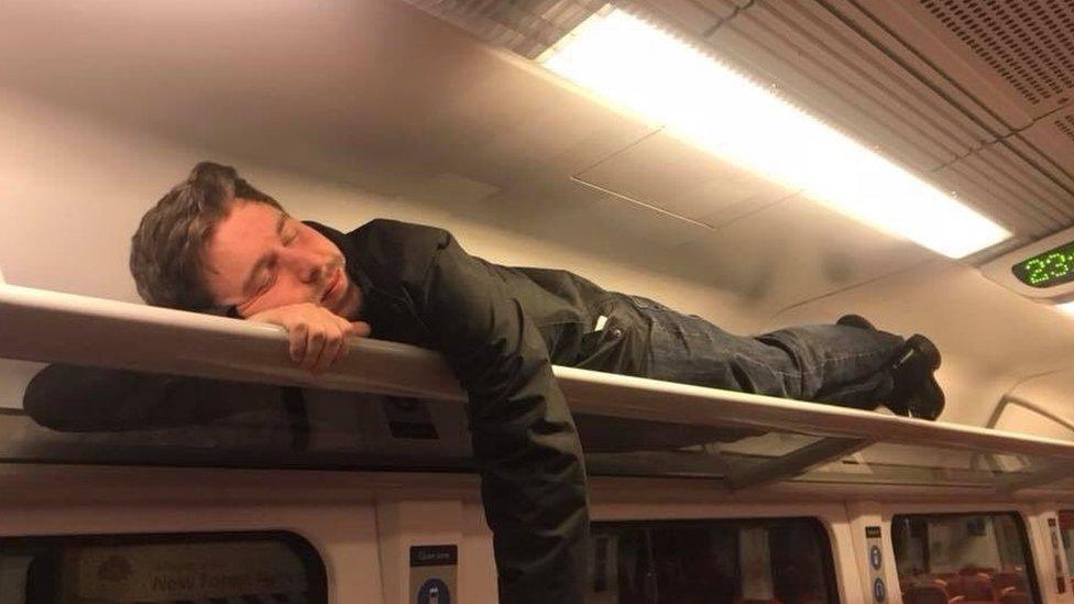 Passenger in luggage rack