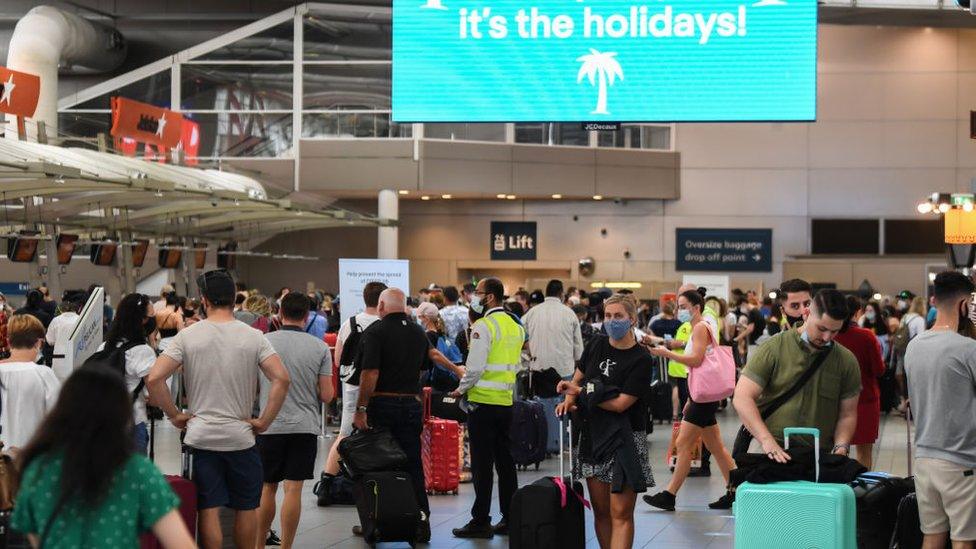 Travellers at Sydney Airport on Friday