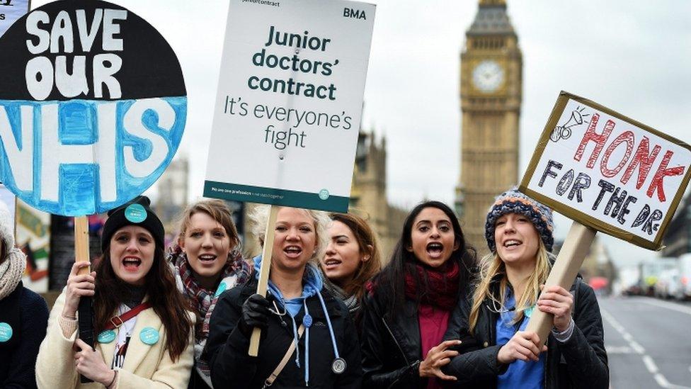 Doctors holding placards