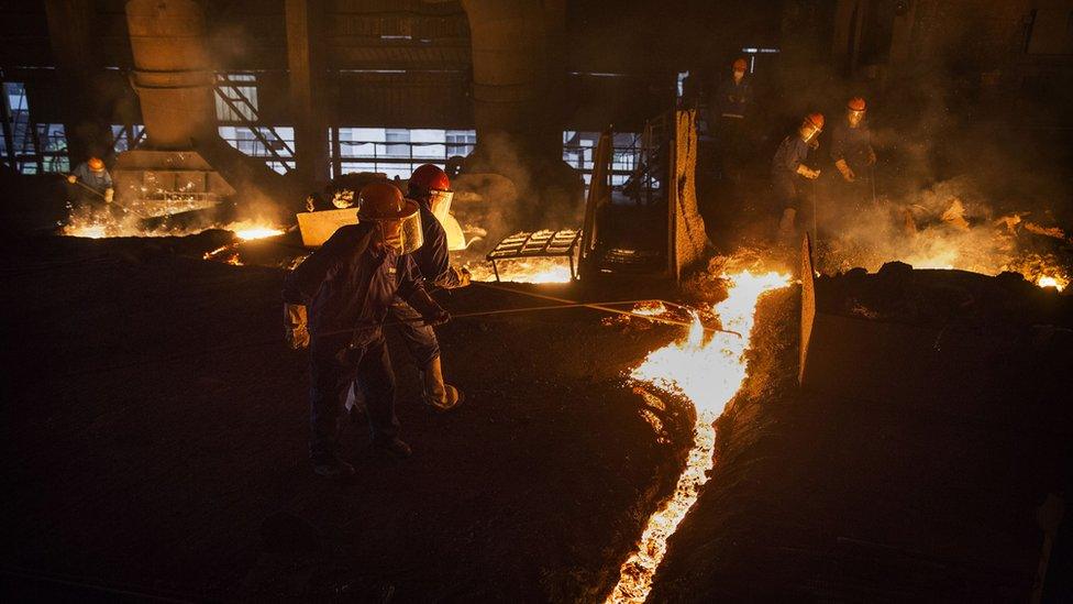 Chinese steelworkers at a smelter