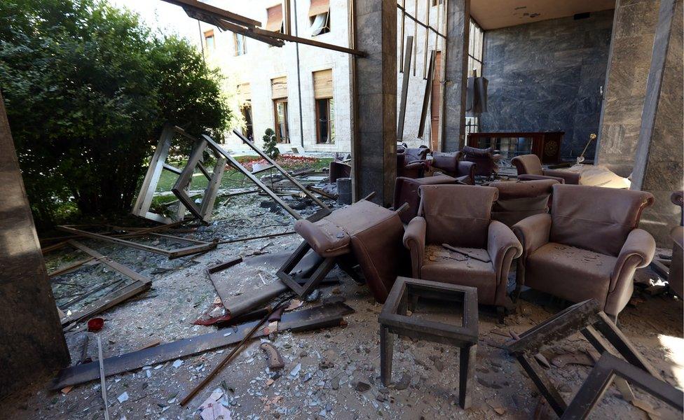 Damage caused by military helicopter bombardments inside Turkey"s parliament near the Turkish military headquarters in Ankara, Turkey, Saturday, July 16, 2016