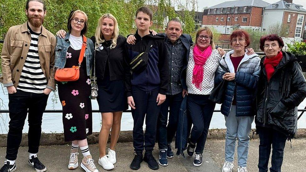 Two sponsor couples pictured with their Ukrainian family - Hannah and David pictured beside Nataliya and Taras, next to Alan and Claire, and Iryna and Helen