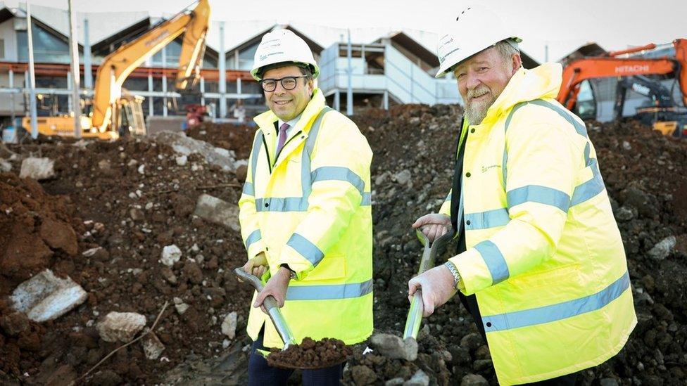 VINCI CEO Nicolas Notebaert and Belfast International Airport managing director Graham Keddie wearing hard hats and holding spades